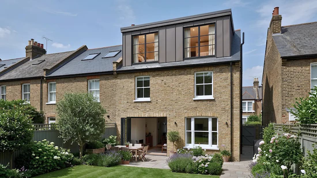 Dormer loft conversion in Wandsworth, London — zinc-clad box dormer above a bifold-door rear extension, by Sovran Group